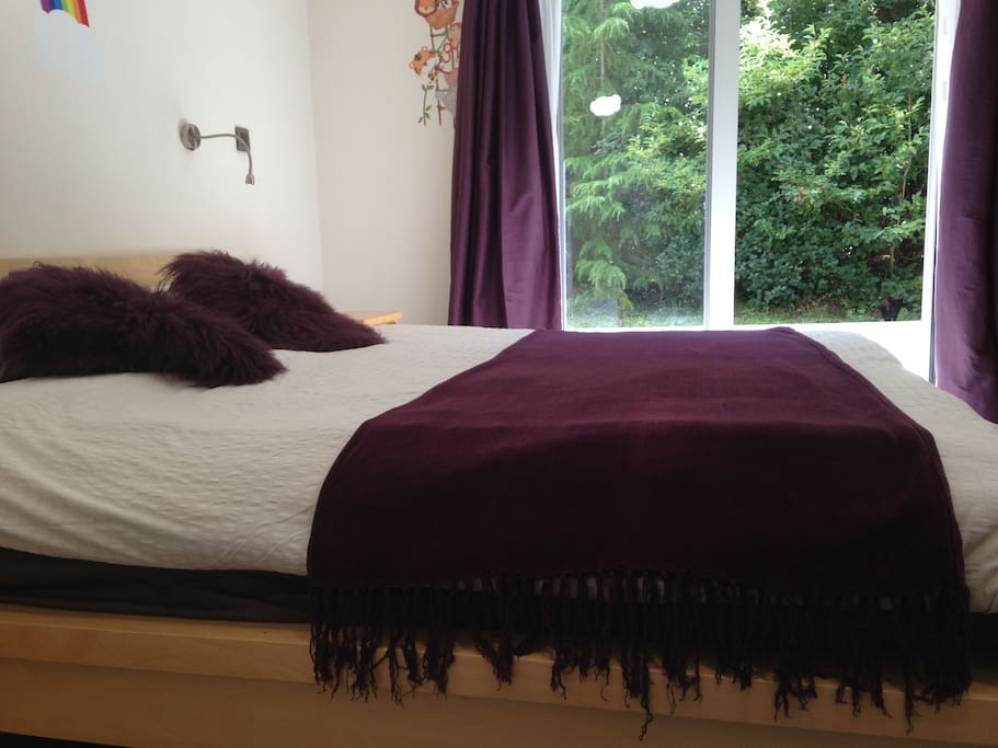 Super king sized bed with outlook onto woodland