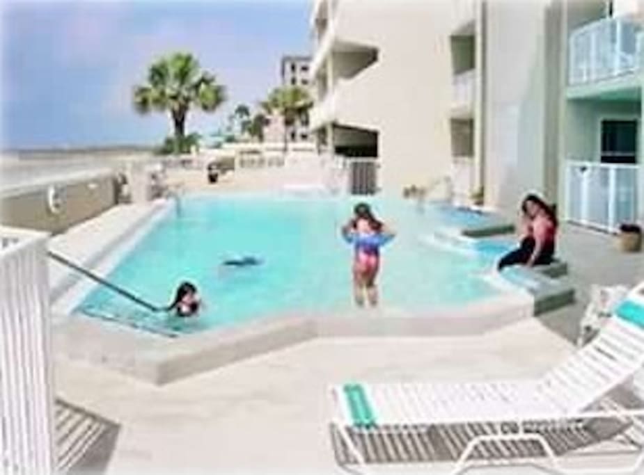 Beachside pool with ample lounging available