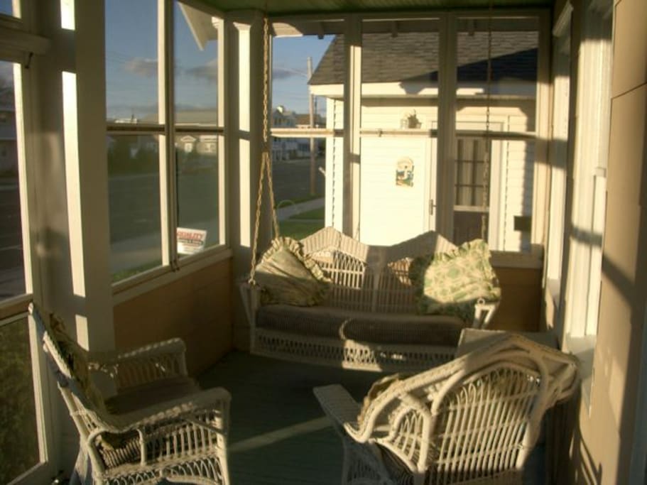 Screened porch, wicker swing--best room in the house.