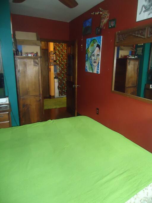 Bedroom hallway leading to bathroom and washing machine