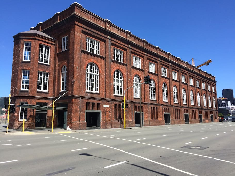 Shed 21, built in 1911, is a Category I listed heritage building converted into apartments by the acclaimed New Zealand architecture firm Athfield Architects in 2001-02. We're on the top floor.