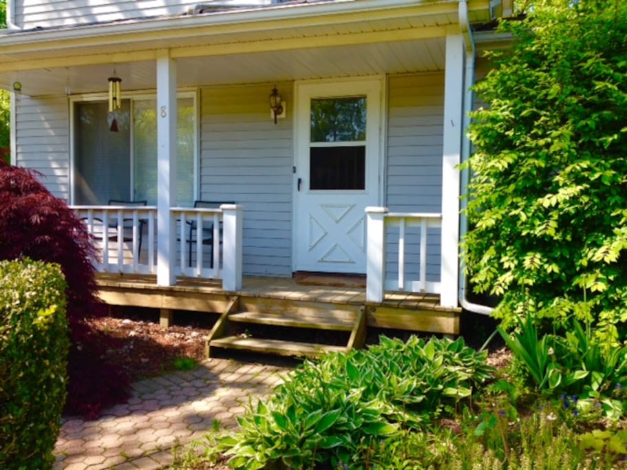 Front door and porch; entry to living room