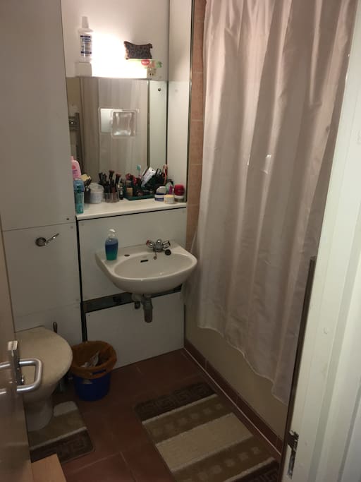 Shared bathroom with a full bath.