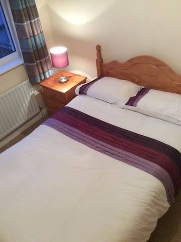 Bright bedroom central to town