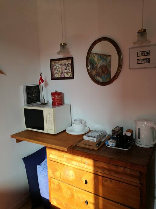 Kettle, microwave oven, coffee and tea.