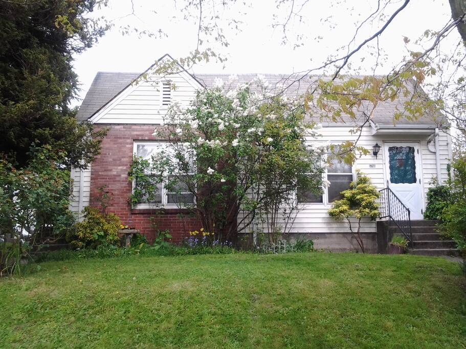 Sidewalk/road view of the front of the home. These windows face east.