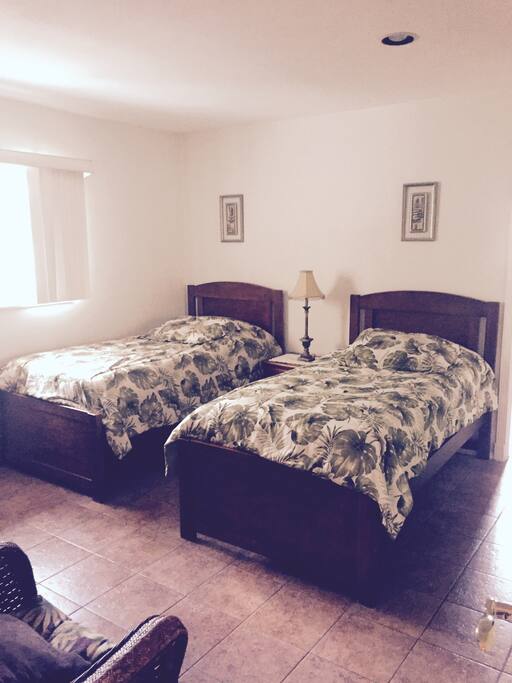 2nd bedroom with twin beds and TV