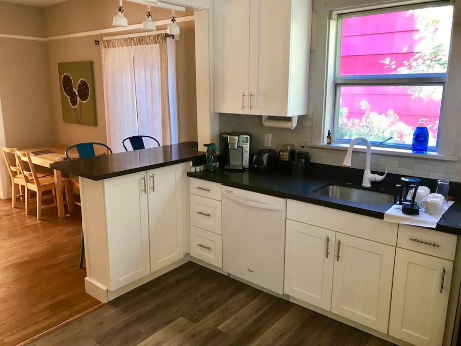 Modern remodeled kitchen with eating bar and dining area