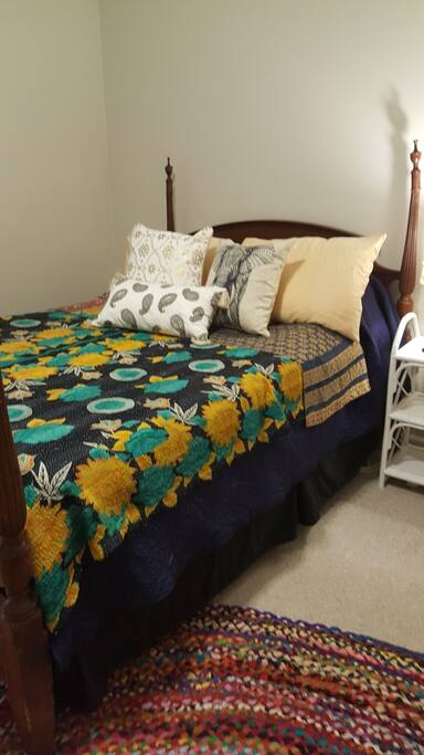 Plush double bed with extra pillows for your comfort.