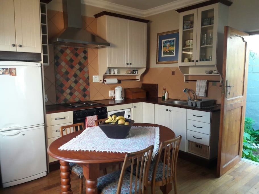 Open plan kitchen with stove, oven and microwave oven.