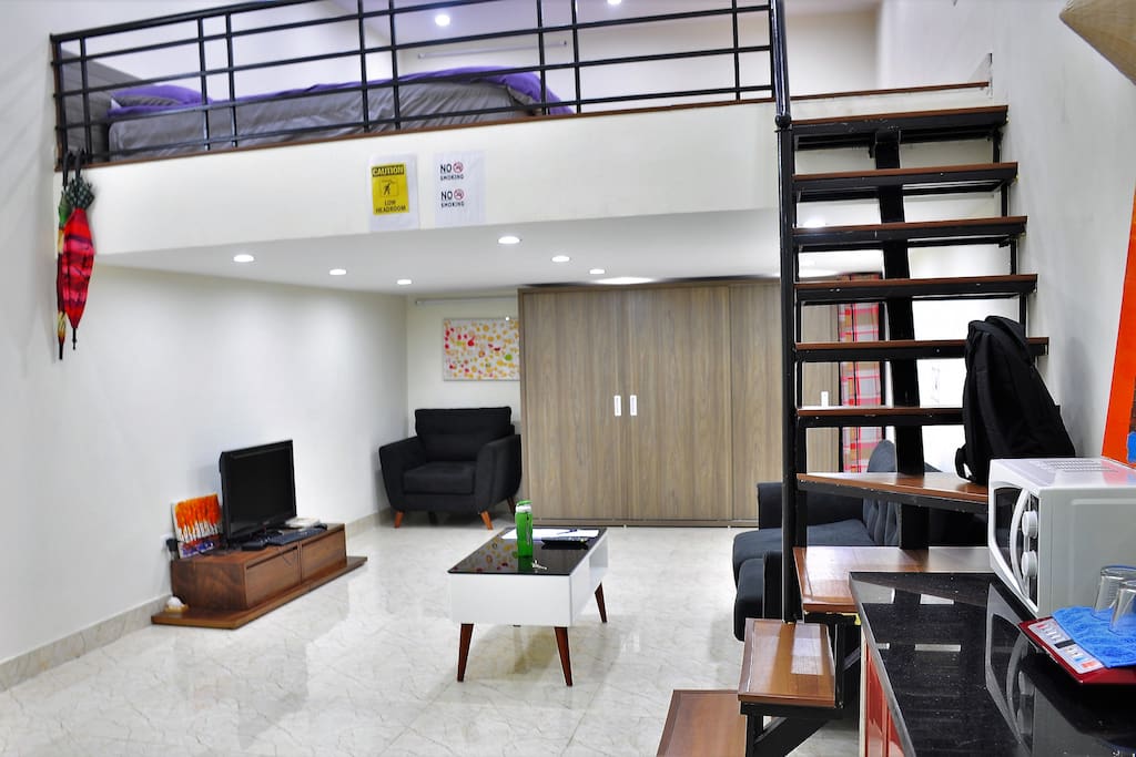 A large studio with sleeping area on the loft