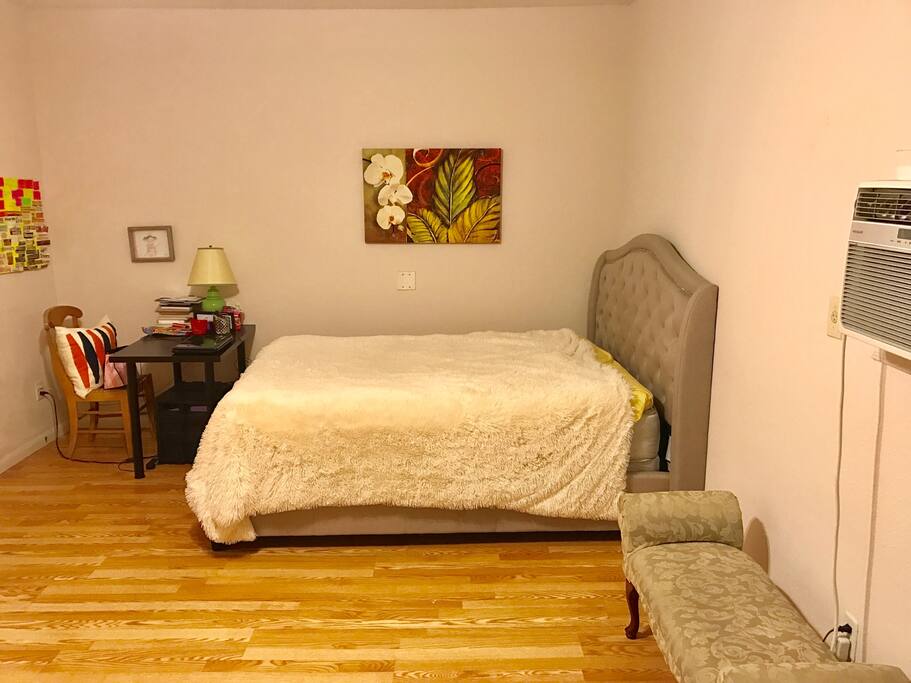 Bedroom from living room area. Queen size bed.