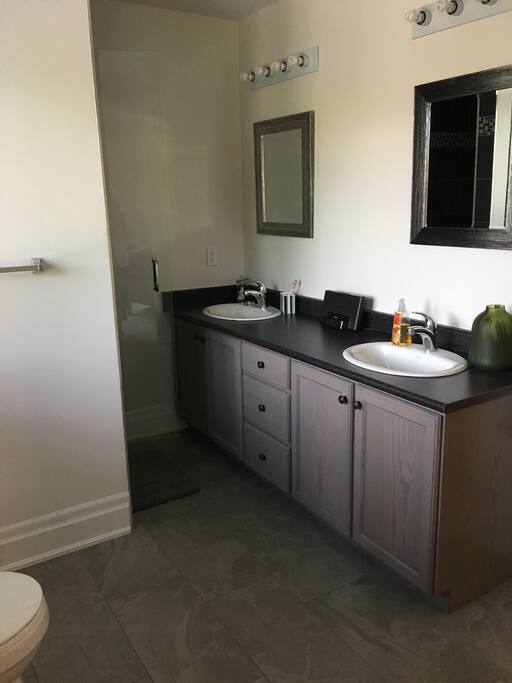 Washroom with shower stall.