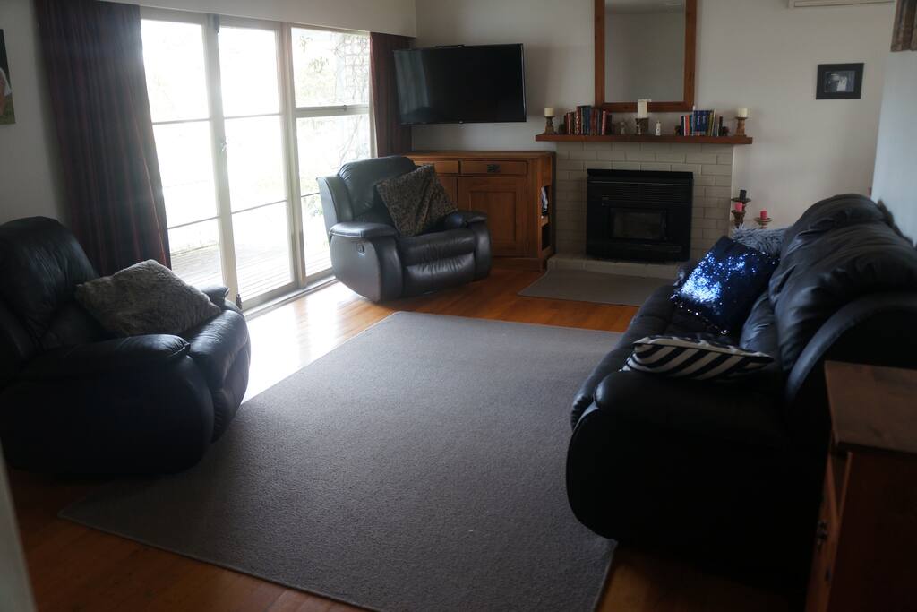 Lounge with recliner chairs and 50" smart TV with inbuilt netflix.