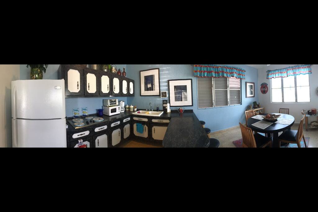 Comfortable equipped kitchen with a countertop and Dinning room