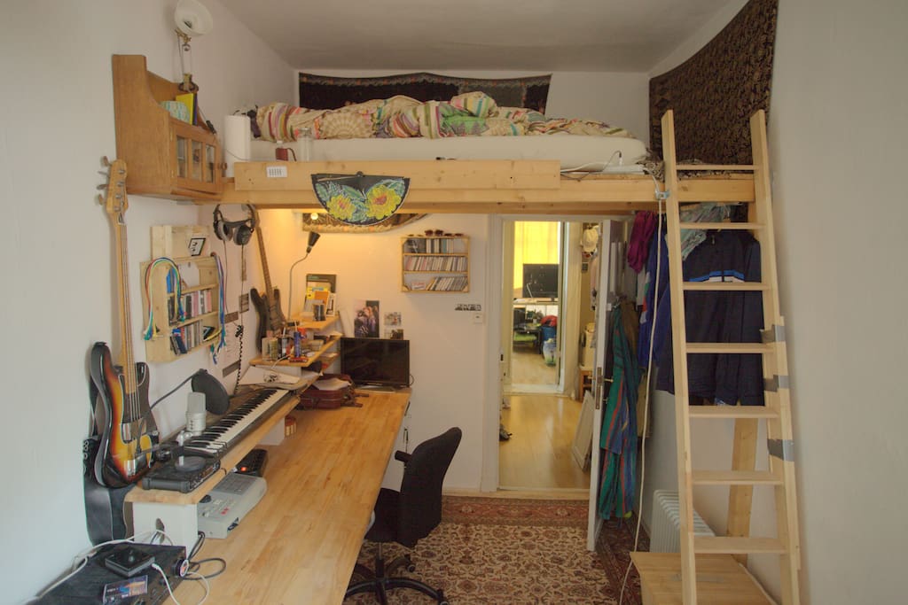 Bedroom with loft bed and large desk