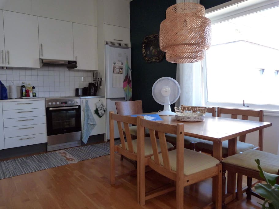 Modern kitchen and table with seating for 6 people