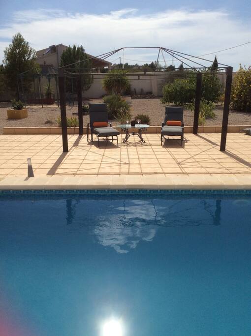Relax by the pool with a glass of sangria