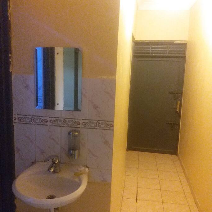 Hand wash basin bedroom corridor leading to shower room (squat toilet)