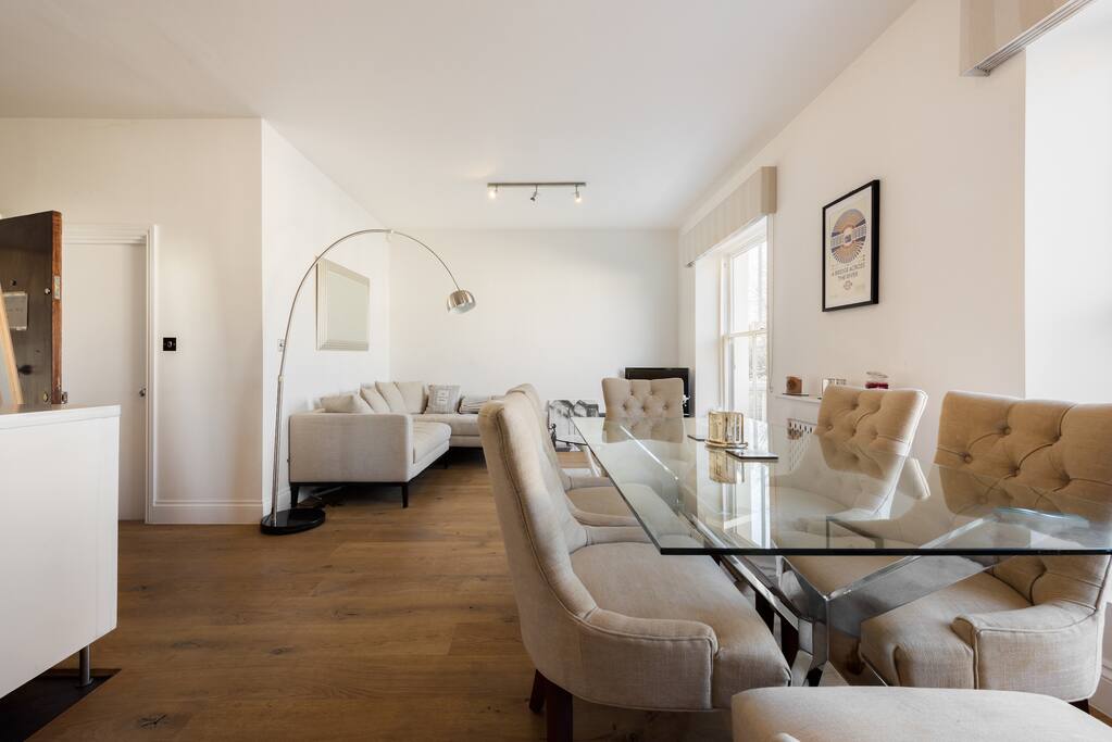 Open living room and dining room. The table easily seats 6 but I've hosted dinner parties of 8.