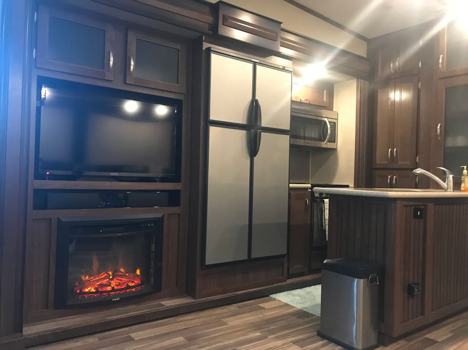 In the living are- full mini-kitchen, tv, dvd player, fire place, ambient lighting, leather seats & dining set for 4! Click the pic and see...