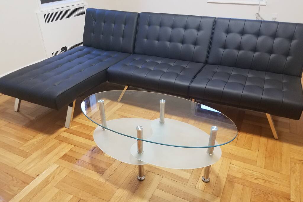 Spacious modern living room with futons that sleeps 3