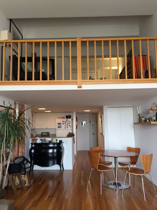 view looking up at loft from living room
