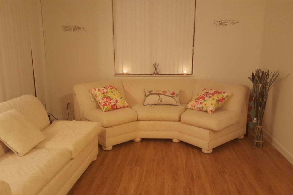 Simple spacey living room with a a balcony and washer/dryer