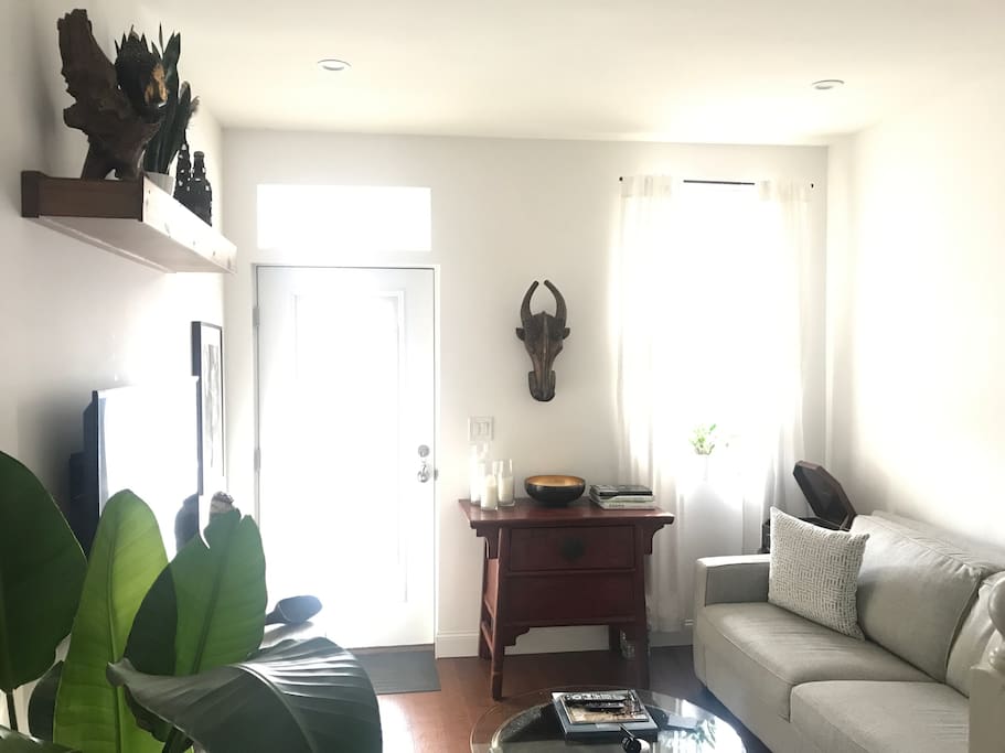 Living room with 48” flat screen smart tv, cable, WiFi, Bose sound system, record player, and Xbox. Couch with brand new full-size pull out bed.