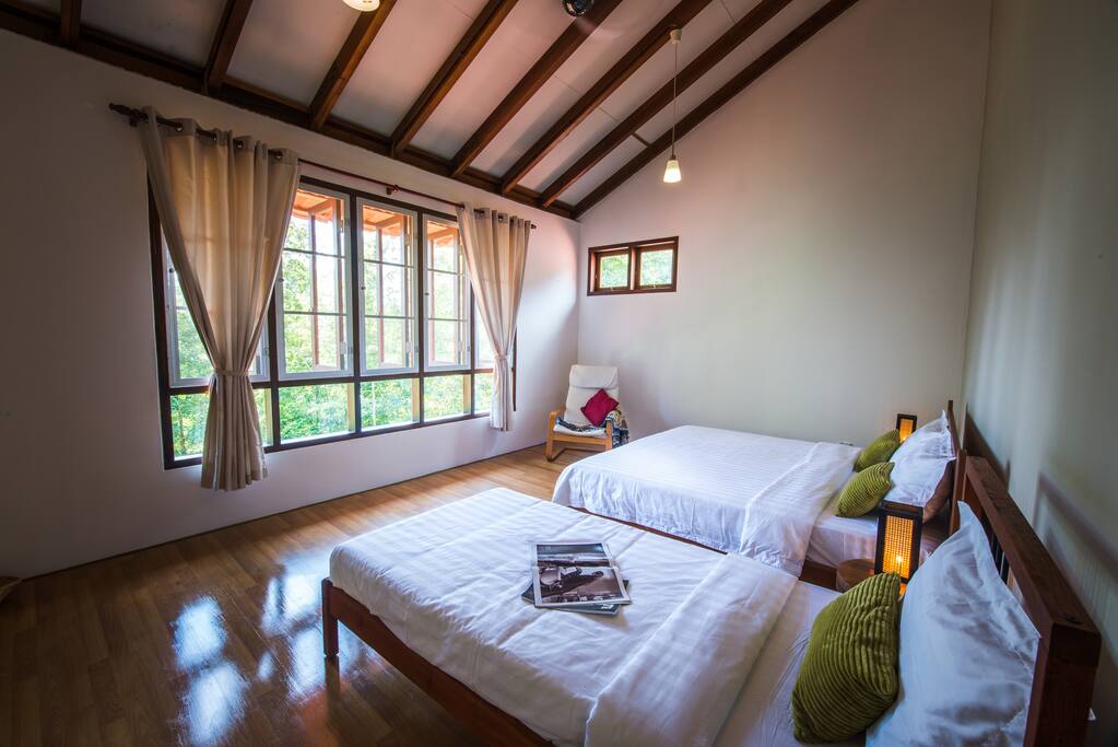 Master Bedroom 2 with 1 king sized bed and 1 single bed, a dressing area and en-suite bathroom.
