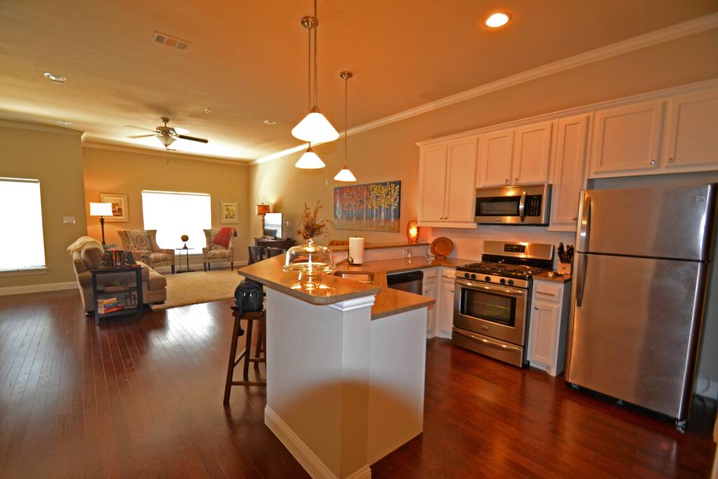 Kitchen with stainless, granite countertops and fully stocked