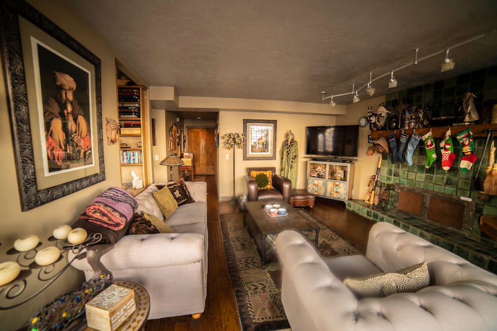 Living room with 55" TV and streaming of all kinds. Working fireplace and artistic interior.