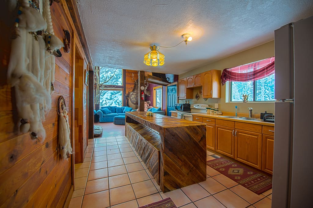 Full kitchen with tons of counter space plus large table!