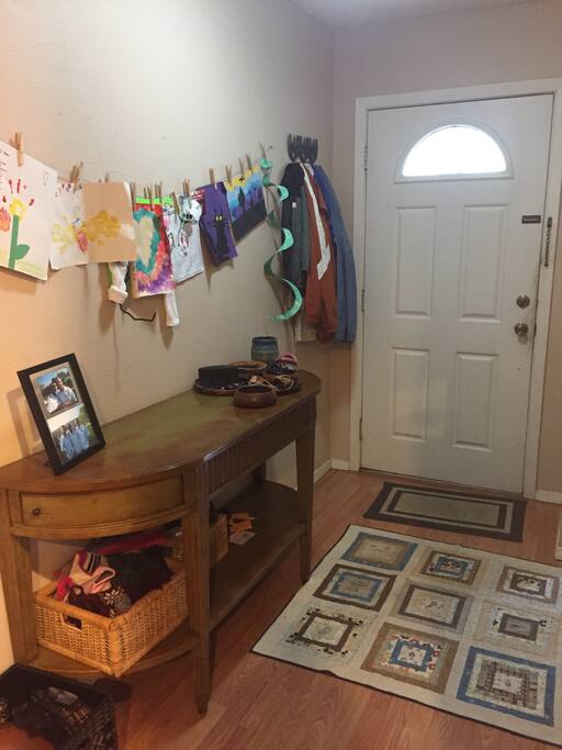 The front entrance to the house with space to put your bags and shoes. Clearly very kid-friendly :)