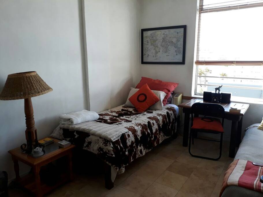 Single bed with desk and radio