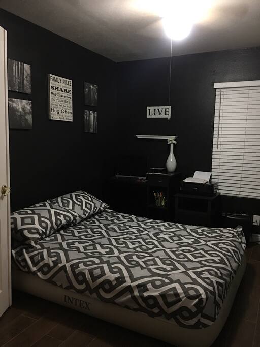 Bedroom 5 Queen size inflatable bed two jumbo pillows new clean sheets ceiling fan works very well ..room is downstairs in home . Usually used as an office . Very close to our kitchen. The restroom is right in front of this room coldest room in our home