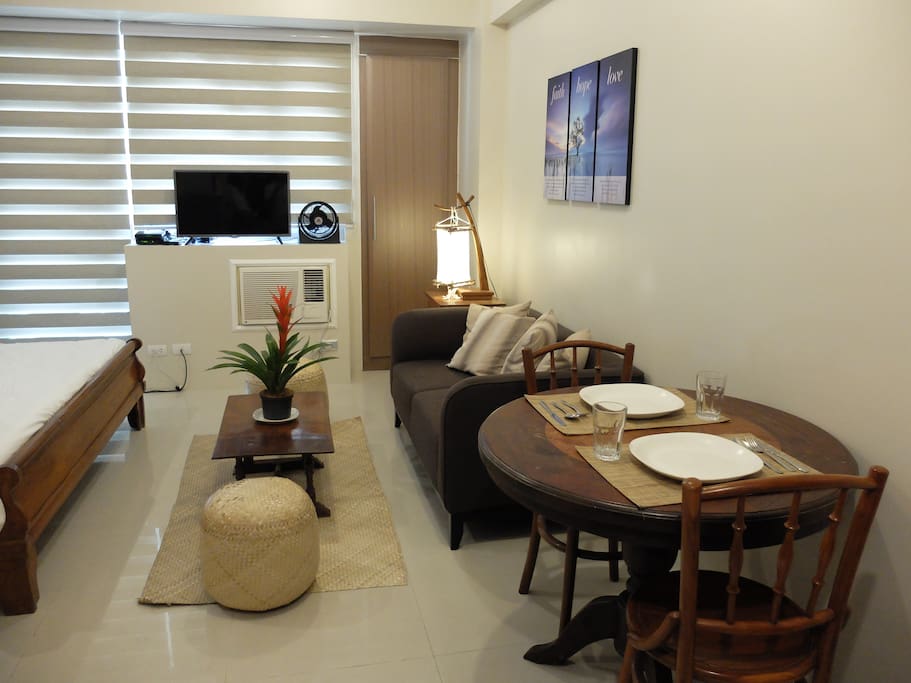 Comfortable couch and dining area with free wi-fi and cable tv.