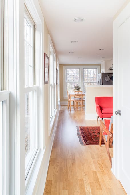 The entrance welcomes you into your cozy home away from home. Ample front hall closet for shoes and coats, heated floors throughout first floor, plenty of warm, natural light.
