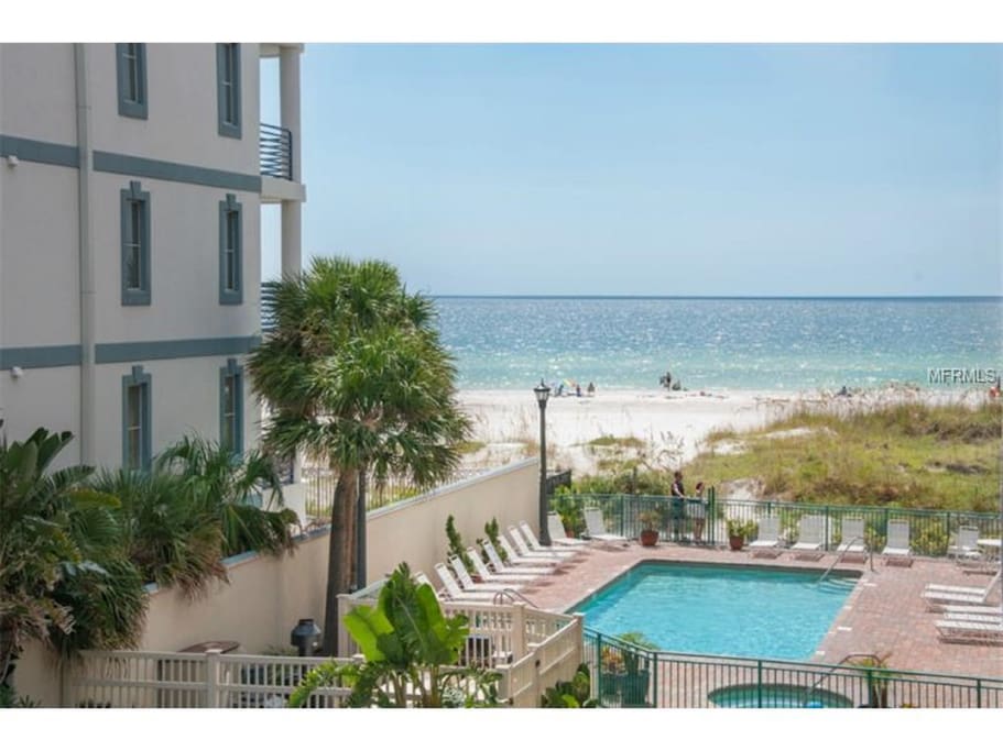View of pool and beach from balcony