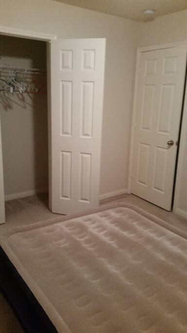 Closet space.
Great for storing luggage and spacious for hanging clothing items.