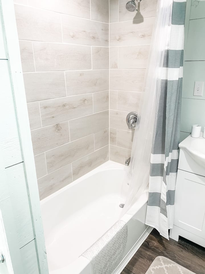 Full-size bathtub and shower. 