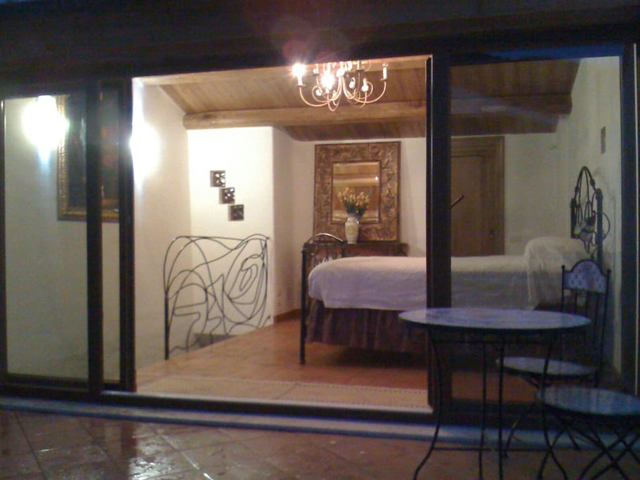 View looking into the upstairs bedroom from the terrace.