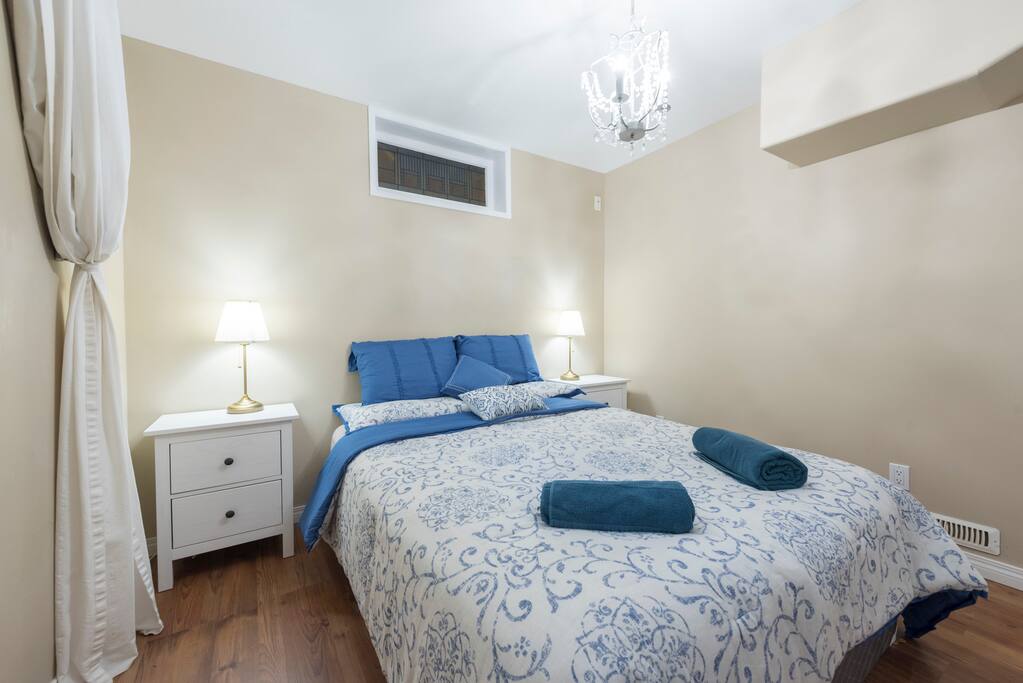 Master Bedroom with 2 bedside tables and lamps. Large wardrobe with hangers.
