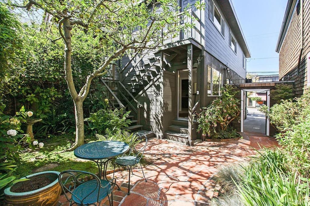 The landscaped backyard shared with the rear house.