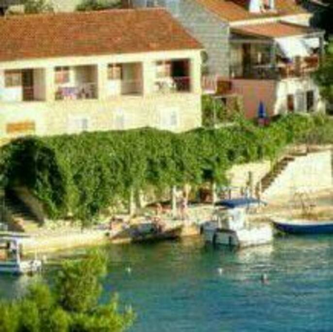 Wiew of the house and beach from the other side of Brna Bay..
