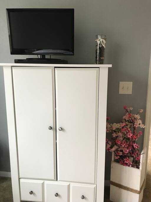 Smaller television provided in bedroom with firestick. Armoire to store clothes and personal belongings.