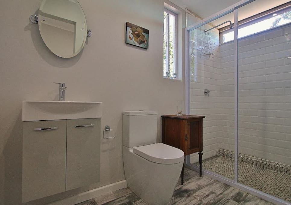 En suite bathroom with very spacious shower cubicle.