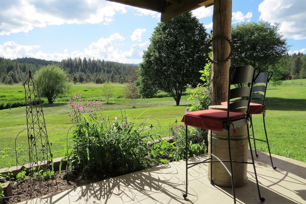View from private covered patio with two, love seats and two high chairs.
