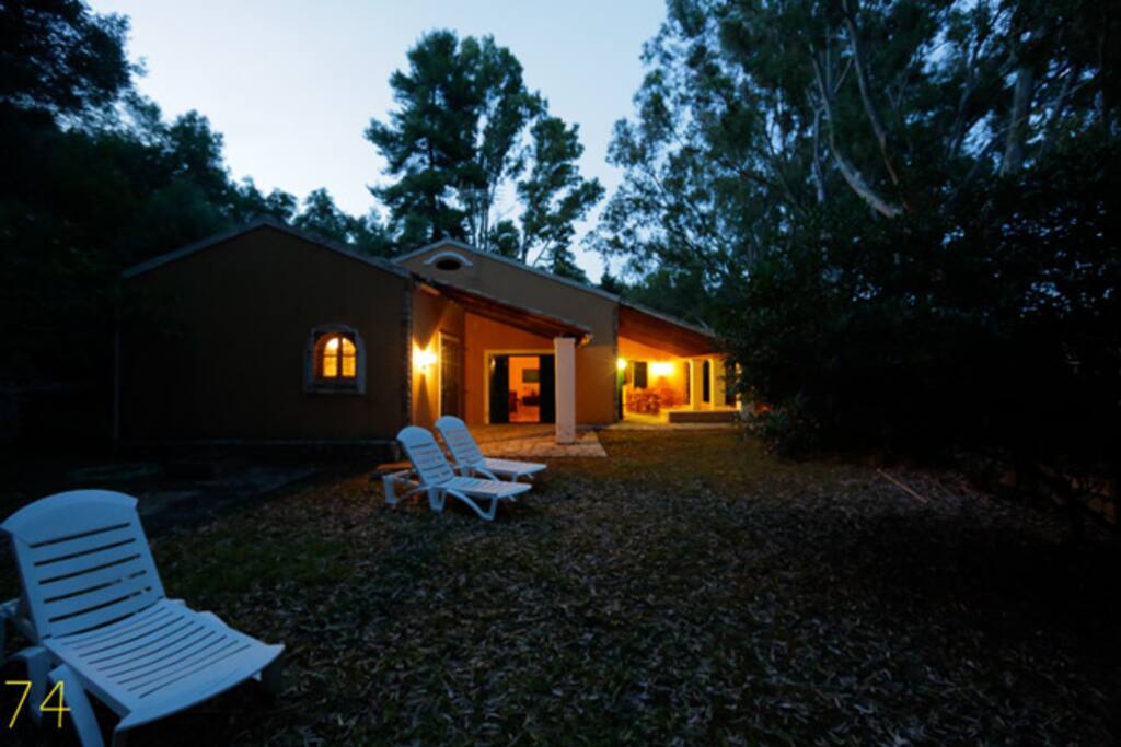 An old olive press converted into a spacious residence, located exactly on the beach, surrounded by private gardens and verandas for quiet seclusion, just steps from the waves.