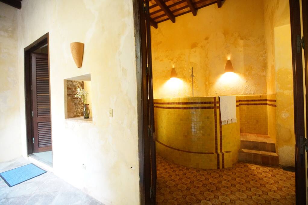 Luxuriate in a historically accurate 18th-century marble Roman-style bath and shower with classic Moroccan tile floors.